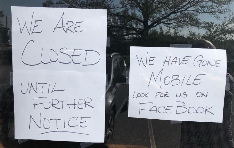 Signs on the door of Trava’s Dog Gone Good Cafe states that it’s closed. (Photo/Andy Johnston)