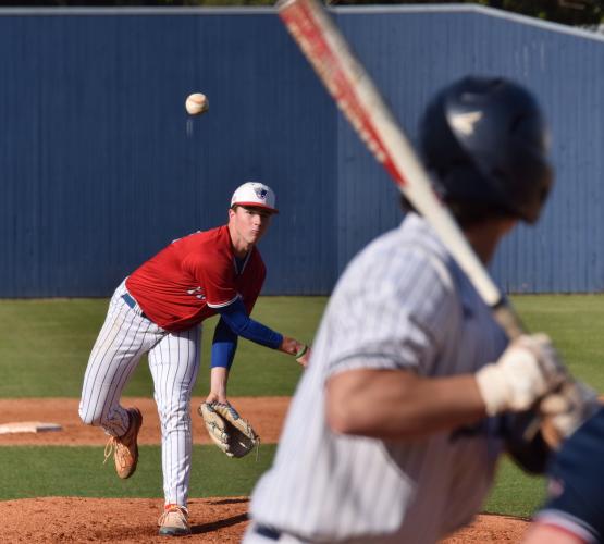 Senior right-hander Bennett England fires a pitch to an Elbert County batter last week. The Blue Devils, who are ranked in Class AA, took both games. (SHANE SCOGGINS/SUBMITTED PHOTO)