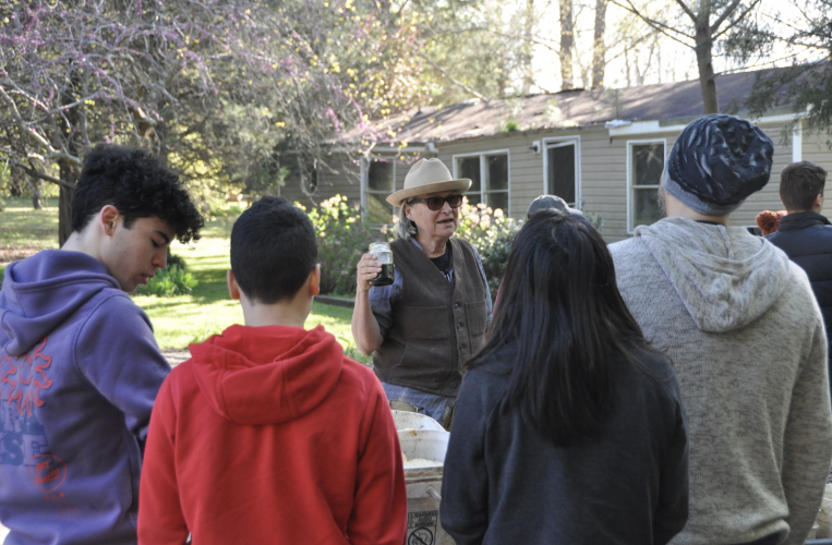 Kat Howkins, co-founder of Sweet Olive Farm, speaks to a group of volunteers recently. Folks can volunteer at the farm from 9 a.m.-noon every Saturday (Elena Westbury/The Oglethorpe Echo)
