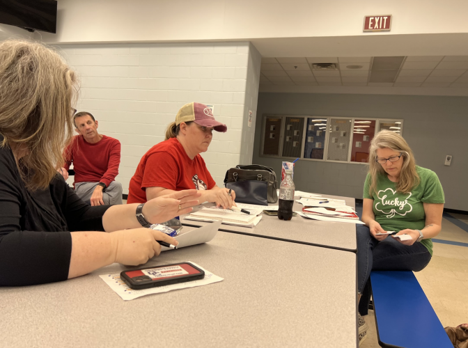 OCHS Athletic Booster Club president Jennifer Frost (right) and secretary Jill Kort (left) discuss additions to the OCHS concession stand at a recent club meeting. (Meredith Boyd/The Oglethorpe Echo)