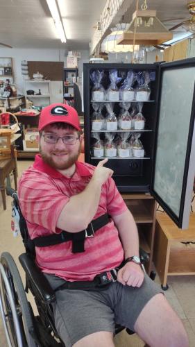 Dillon Lewis, co-owner of D-Lo's Delights, sells the company's gourmet cupcakes at Crossroads Odds and Ends in Arnoldsville every week. Flavors have included key lime, lemon blueberry and raspberry white chocolate. (Submitted Photo)