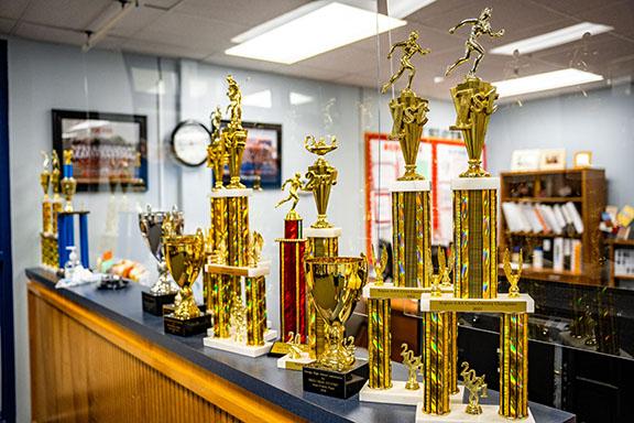 All the trophies brought home by OCHS athletic teams for the 2021-2022 school year, on display in the school's front office. (Photo/Jack Casey)