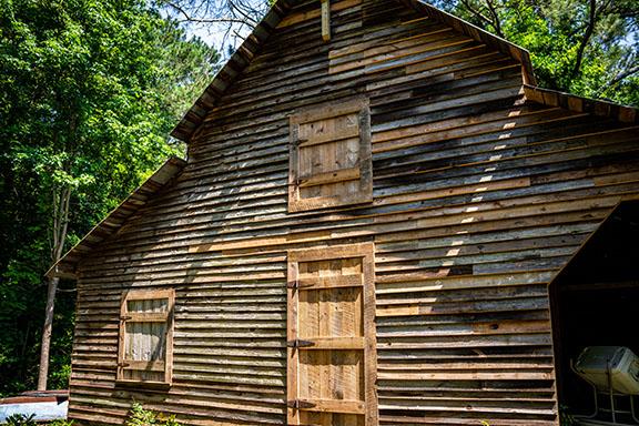 Donna Wetterlund has raised $6,500 of the estimated $20,000 it will take to finish restoring the barn on her daughter's property on Elberton Road. (Photo/Jack Casey)