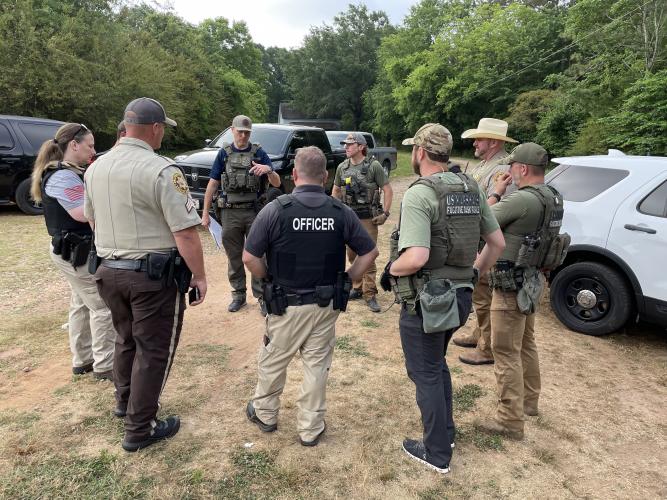 Law enforcement officers with various agencies, including the Oglethorpe County Sheriff’s Office, get together during Operation Washout Classic City, which resulted in 49 arrests in several counties. (Submitted Photo)