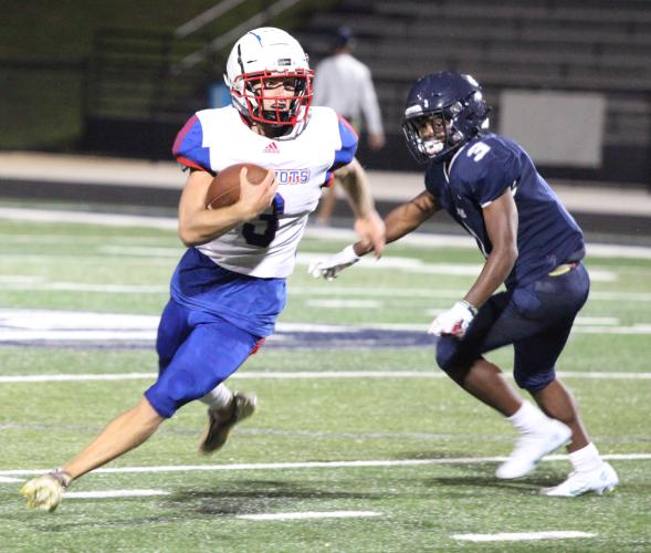 Quarterback Will Sampson cuts upfield during the Patriots’ 42-0 victory at West Hall in Friday’s scrimmage. OCHS hosts East Jackson at 7:30 p.m. Friday. (Photo/Donny Faust)