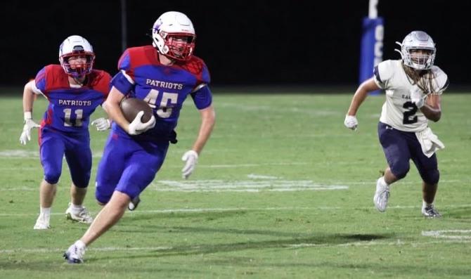 Tanner Nation, who led OCHS with five tackles, heads upfield after picking off a pass in Friday’s victory. (Photo/Donny Faust)