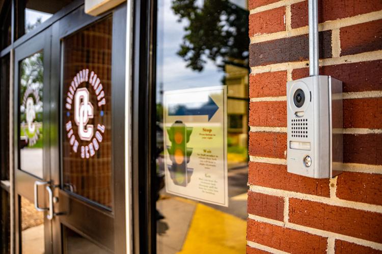 Security devices, including cameras, locks and buzzer systems, are at the doors of the county’s schools. (Photo/Jack Casey)