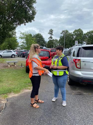 Oglethorpe County Sheriff’s Office Sgt. Samantha Mathe, right, was part of a group that checked child booster seats at the primary school. (Submitted Photo)