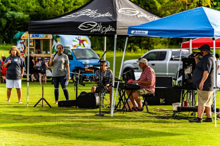Tents filled the recreation fields as bands, vendors and local organizations set up and handed out supplies and information. (Photo/Jack Casey)