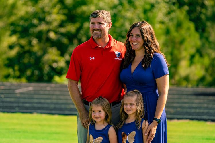 Offensive coordinator Gary Hughes with wife Erica Hughes and their children Brynlee and McKynlee. (Photo/Jack Casey)