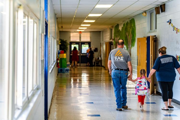 Willow Paulk, a kindergartner at Oglethorpe County Primary School, walks to class with her family on her first day of the new school year. (Photo/Jack Casey)