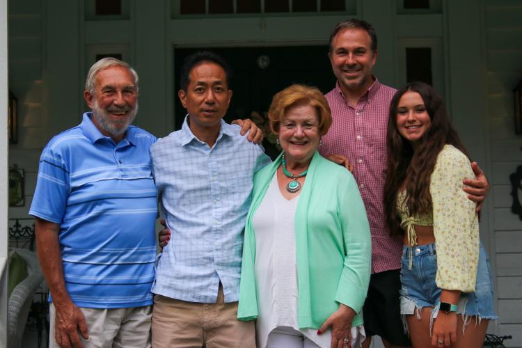Former Oglethorpe County Japanese exchange teacher Hidekatsu Sakamoto, second from left, gathers with Warren Gilson, left, and Sherry Gilson, center, along with their son, Wesley, second from right, and granddaughter Carly before dinner on Aug. 24. (Aisha Schulz/The Oglethorpe Echo)