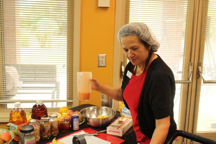 (Andrea Gutierrez/The Oglethorpe Echo) Former center director Dee Pelewski makes a smoothie blend for seniors on “Fruit Smoothie Day” at the Oglethorpe County Senior Center last Friday.