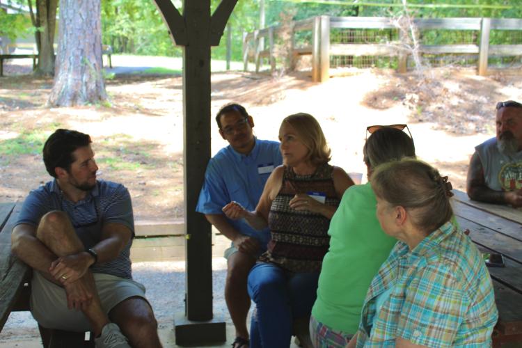 Family members reminisce and tell tales of how they found their connection within the Booth-Moore family tree. The family has had a reunion for 44 consecutive years. (Lily Baldwin/ The Oglethorpe Echo)