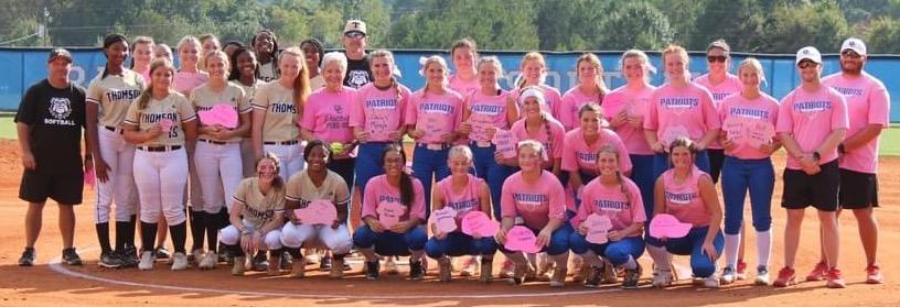 The OCHS softball team held a Pink Out game against Thomson on Monday. Both teams posed for a photo afterward. (SUBMITTED PHOTO)