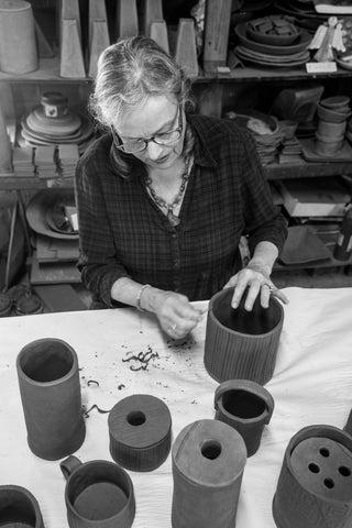 Local artist Rebecca Wood works on a ceramic project in her studio in Athens. Wood has been involved in the Oglethorpe and Athens art communities for nearly 50 years. (Submitted photo)