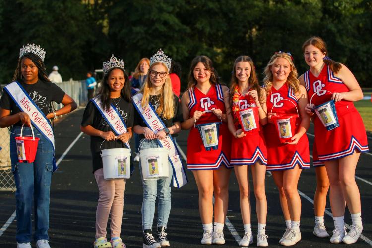 Winners of the Miss Oglethorpe Pageant and OCHS cheerleaders hold buckets for donations to support Jacob Dake, Oglethorpe County high school, Sept. 29, 2022. Dake was in a motorcycle accident on Sept. 15, and has had extensive surgeries since. (Aisha Shulz/The Oglethorpe Echo)