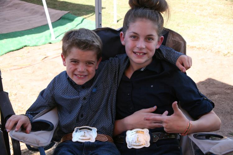 Cam (left) and Naomi McPeake show off their belt buckle prizes at the Georgia National Fair this weekend. (Submitted Photo/Shanna Reynolds)