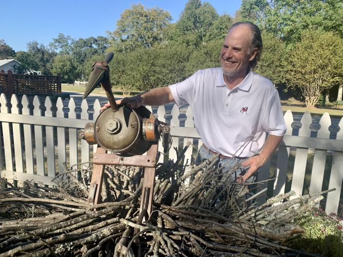 Edward Toledano poses with his work entitled "Larry Bird" at The Gillen House Bed and Breakfast on Oct. 8, 2022. (Photo/Nimra Ahmad)