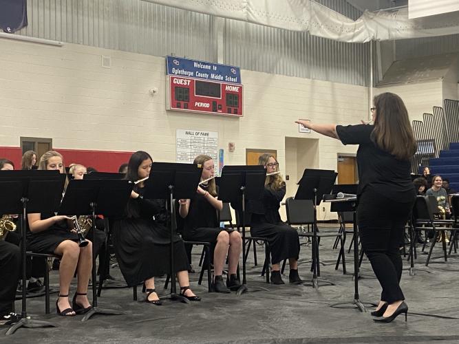 OCMS band director Erin Serrian leads the jazz ensemble through a portion of its concert on Tuesday. The sixth-grade band and a combined band of seventh- and eighth-graders also performed. (Photo/Emily Rose Hamby)