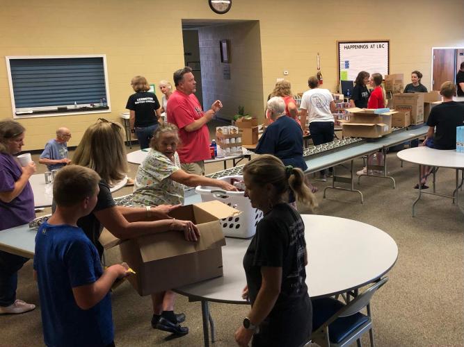 Volunteers at Lexington Baptist Church sort food into boxes for families visiting the mobile food pantry. The boxes of food are dispersed drive-through style every second Monday of the month. (Submitted Photo)
