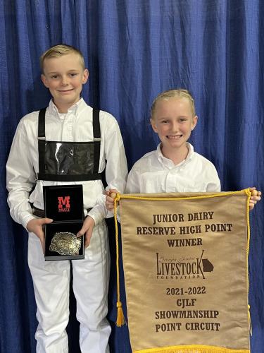 Luke (left) and Camden Huff show their livestock showing awards from the state fair this weekend. (Submitted Photo/Shanna Reynolds)