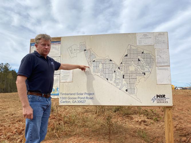 Chairman of the Board of Commissioners Jay Paul shows a map of the Timberland Solar Project, to which he is opposed.