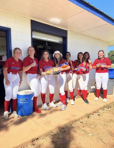The Oglethorpe County softball team enjoys a snack to help refuel for a game. Oglethorpe County Family Connection’s “Nutrition Hydration” helps take some of the burden of feeding athletes off their parents. (Submitted Photo)