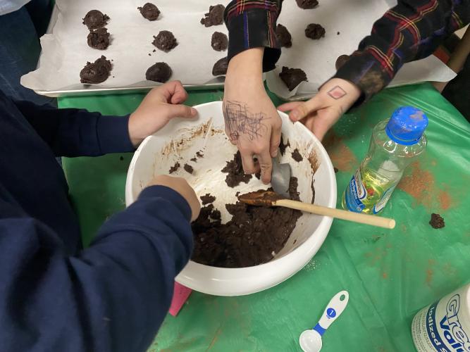 Students use scoops to form chocolate cookies at the Cooking to Share program on Nov. 17. The program, run by the Oglethorpe County 4-H Club, allows fifth- and sixth-grade students to cook a meal for a family in need. (Erin Kenney/The Oglethorpe Echo)