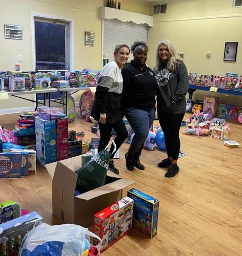 April Moore (from left), Marteca Adkins and Tina Welch-White helped organize and distribute last year’s donations of gifts for Community Christmas. (SUBMITTED PHOTO)