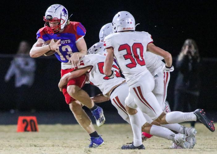 OCHS strong safety Nate Irwin attempts to break free from Social Circle defenders Grayson Jenkins and Bryan Ross. OCHS homecoming game, Friday, Oct. 28, 2022. (Aisha Schulz/The Oglethorpe Echo)