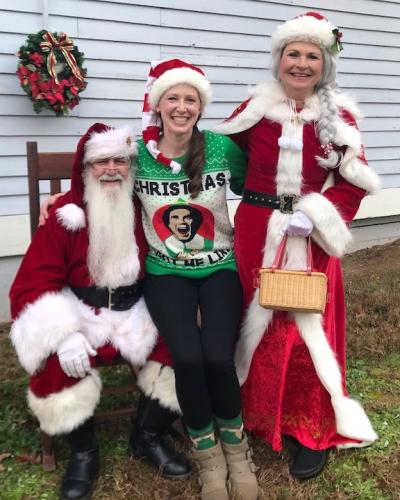 Heather Parham spends time with the guests of honor - Mr. and Mrs. Claus - at last year's Maxey's Christmas Parade. Parham, as the organizer of this year's parade, added musical acts, including Noteworthy, an a cappella group from UGA. (Submitted Photo)
