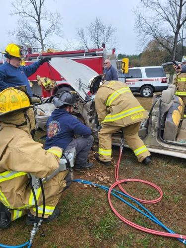 Mike Moravek (pictured right), assistant chief at the Vesta Volunteer Fire Department, partakes in the vehicle extrication class. (Photo Courtesy/Jennifer King)