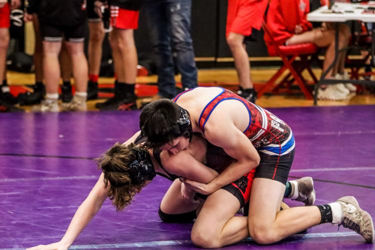 Oglethorpe County freshman Keagan Moats begins in the referee's position against an opponent from North Oconee at the North Oconee Duals on Saturday.