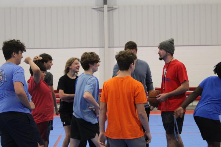 Tanner Nation, who plays football and baseball at Oglethorpe County High School, devotes part of his free time to coaching basketball at the rec department. (MAGGIE RULAND/THE OGLETHORPE ECHO)