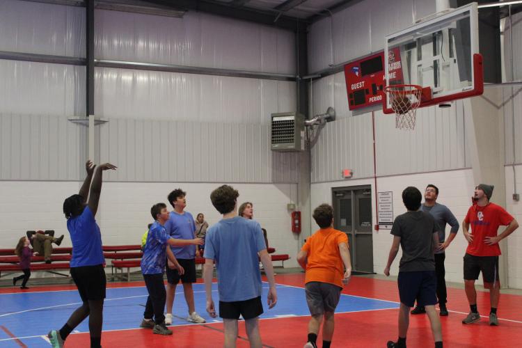 Coach Tanner Nation puts his team through free-throw practice at the Oglethorpe County Recreation Department. They have to make a set number of shots to cut down on their running after practice. (MAGGIE RULAND/THE OGLETHORPE ECHO)