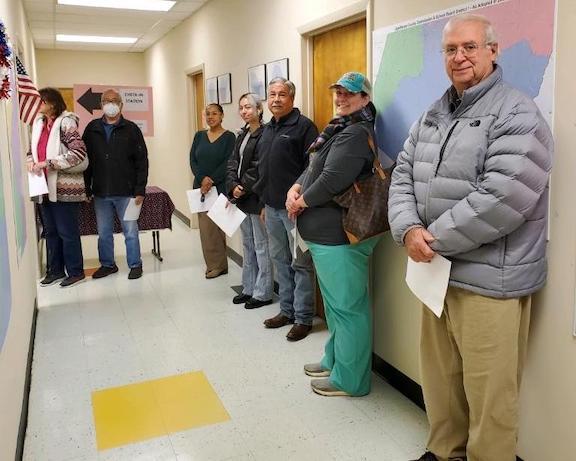 Residents stand in line to vote early Tuesday in the Senate runoff between Sen. Raphael Warnock and former UGA football star Herschel Walker. (Submitted Photo)