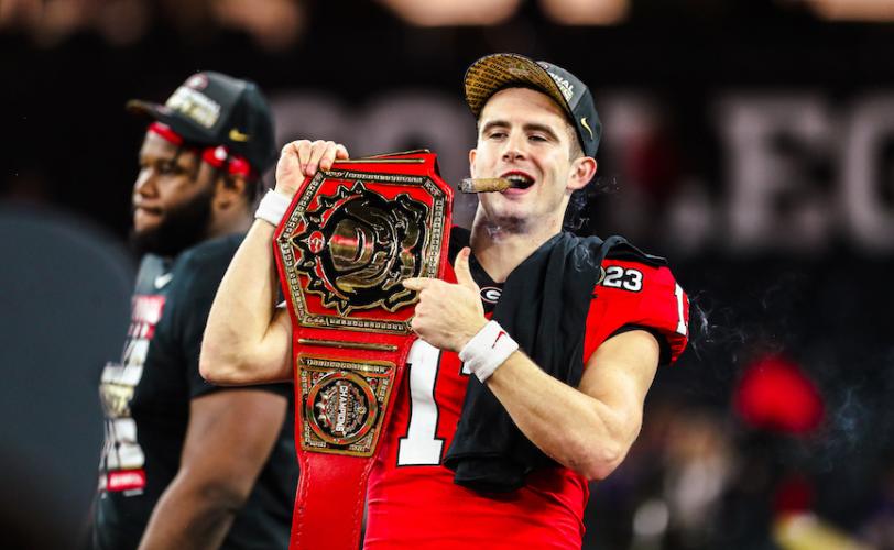 Stetson Bennett, complete with cigar and championship belt, revels in the atmosphere after Georgia won its second consecutive CFP National Championship on Monday. (Photo/UGA Athletic Association)