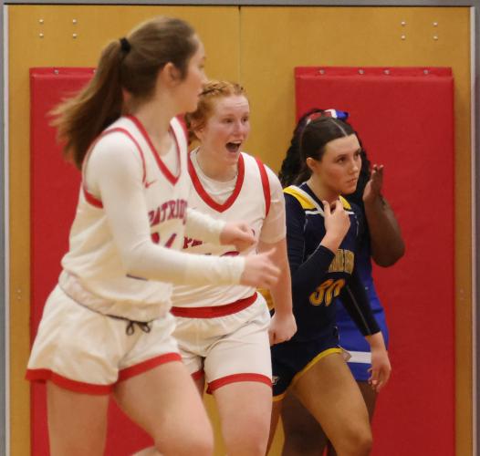 Abby Jones, junior, cheers after her teammates scores a basket in a basketball matchup between Oglethorpe County and Prince Avenue. (Photo/Emily Dozier)