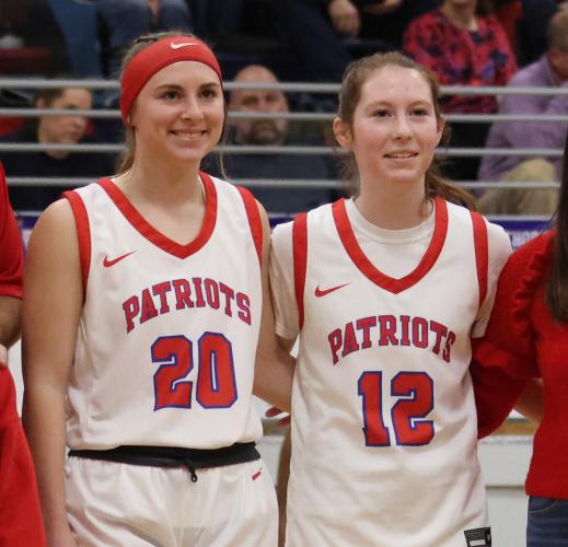 Senior Claire Gabriel, left, is joined by sister Carlie Gabriel, a freshman, during Oglethorpe County basketball's senior night celebration. (Photo/Emily Dozier)