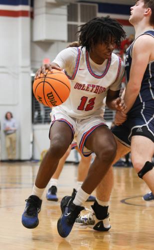 Kirkland Ross, a senior, stays aggressive on offense during Oglethorpe County High School basketball's game against Prince Avenue. (Photo/Emily Dozier)