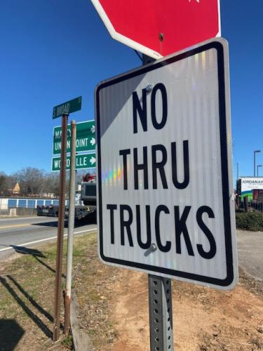 A sign on South Broad Street in downtown Crawford states "NO THRU TRUCKS," but truckers sometime disregard the signs, which can lead to damaged roads throughout Oglethorpe County. (Photo/Sydney Bishop)