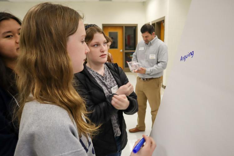 At Oglethorpe County Middle School on Feb. 9 the students of the Youth Leadership course work together to identify the components of a conflict. Students Maggie Barnes, Lyla Casper and Gloria Hgay brainstormed together during a class activity of describing conflict. (Photo/ Viktoria Kangas)