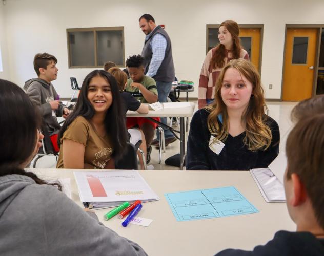 Heli Patel and Ashlin Warren work with their new group of the day in the Youth Leadership Oglethorpe course on Feb. 9. Together they identified and discussed what the different components of conflict are. (Photo/ Viktoria Kangas)