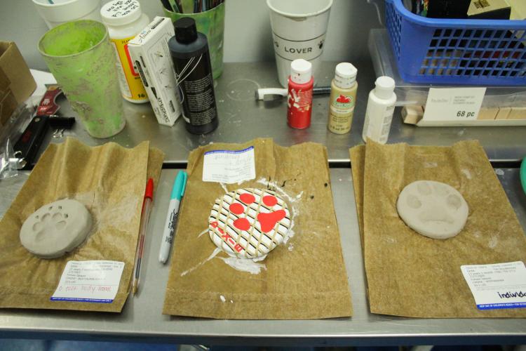 Dog prints of euthanized pets dry on the counter of the Oglethorpe Animal Clinic in Crawford, Georgia on Monday, September 19, 2022. The clinic takes prints of the animal so that the owner may have a token of their pet to keep with them always. (Photo/Basil Terhune)