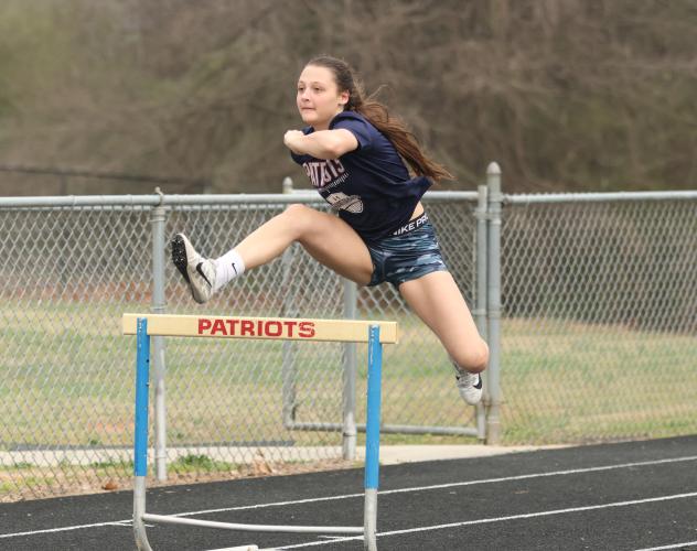 Junior Avana Stewart works on the hurdles at practice as she and the other members of the OCHS girls track team aim for their third straight state title. (Photo/Emily Dozier)