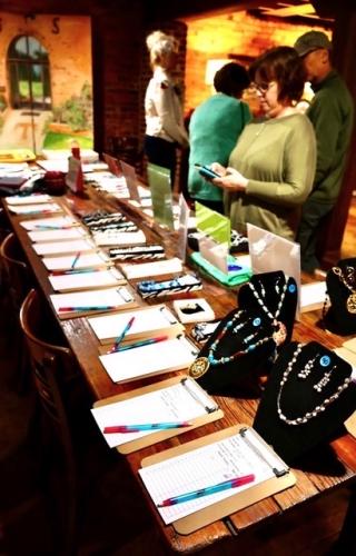 Donations fill tables at the eighth annual Bark &amp; Wine fundraiser. The Madison Oglethorpe Animal Shelter's largest fundraiser of the year took place at the Historic Smithonia Farm March 11.