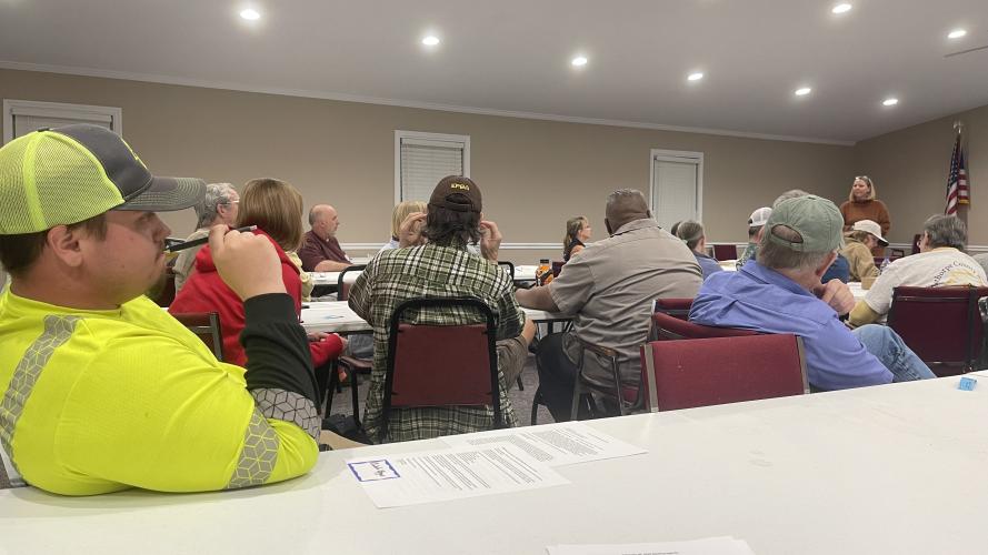 Caleb Epps, a new member of the Oglethorpe County Bee Club, listens to guest speaker Annette Kleiser explain a new honeybee vaccine. Epps, who has two hives, joined the club to gain knowledge and share ideas with other members. (Photo/Olivia Shapiro)