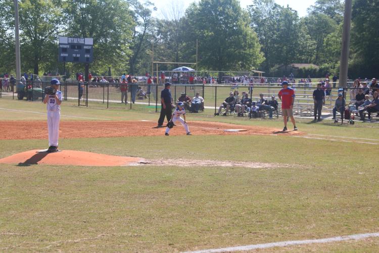 (JACK RHODES/THE OGLETHORPE ECHO) Coleman Rogers winds up to throw the first pitch of the opening little league boys 10 under game. It was a great day for baseball with the sun out and the temperature being in the 70s for the first games. 