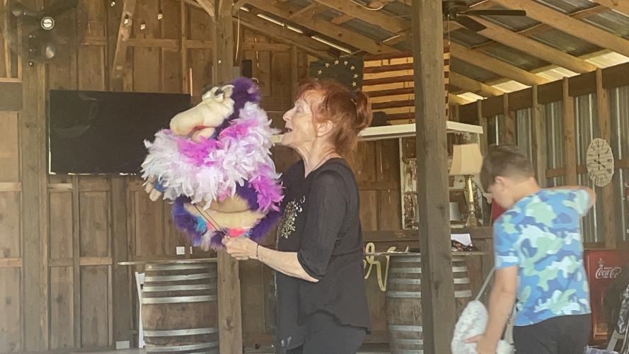 Mary Wooten of the Wooten Woopets leads a dress rehearsal in the barn at Platt Brooks Estate in advance of Saturday’s performance as part of the Downtown Development Authority 2023 Concert Series. Wooten wanted to practice her dance moves to ensure that the audience would be engaged. (SOPHIE MCLEOD/THE OGLETHORPE ECHO)